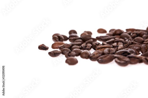 Scattered coffee beans isolated on white