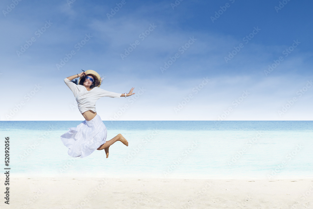 Asian tourist jump at white sand beach Asian tourist jump at white sand beach