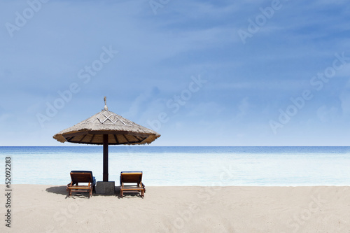 Beach chair and umbrella straw on beach