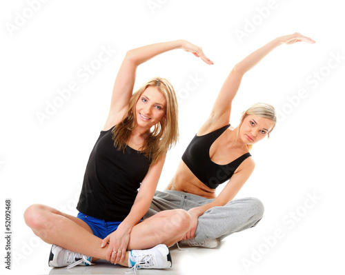 Two women doing fitness exercise isolated