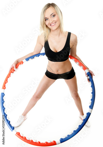 young fitness woman with hula hoop isolated © Voyagerix