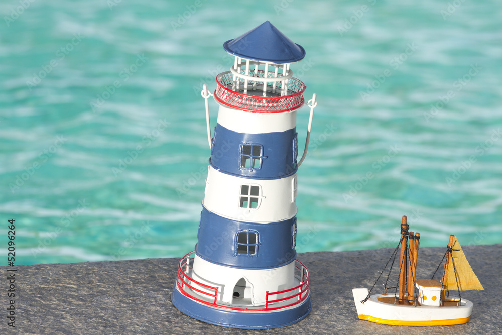 toy lighthouse,toy lighthouse yellow sailboat pool background