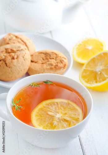 Fresh tea with lemon in the white cup