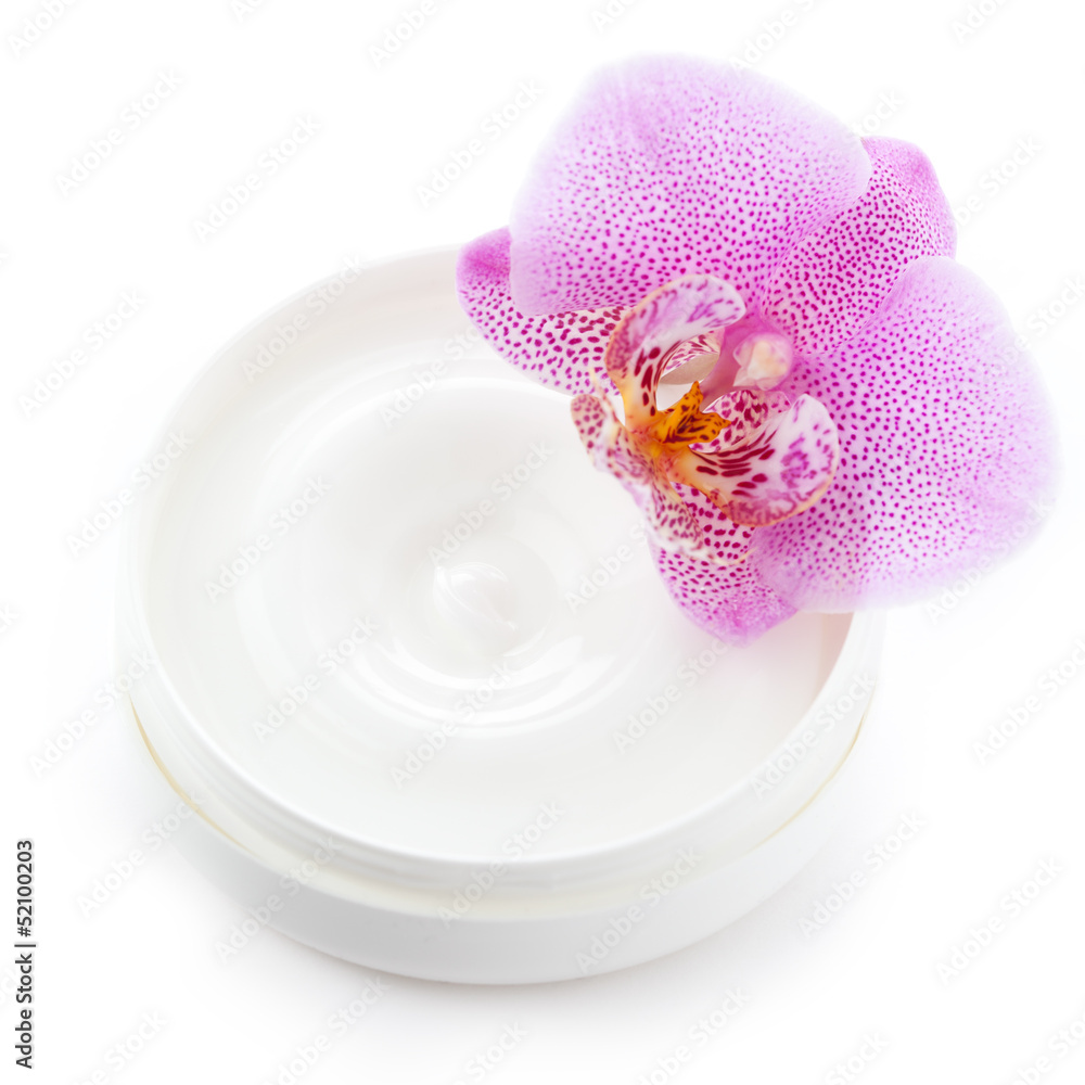 Pot of white cream with orchid on white