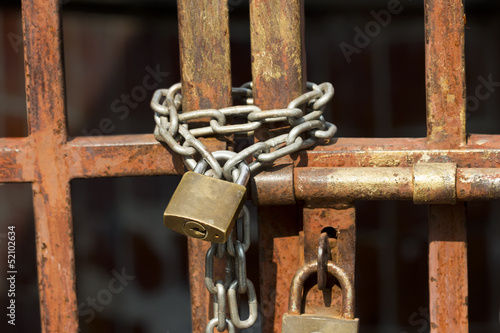 locked chain on old rusty gate