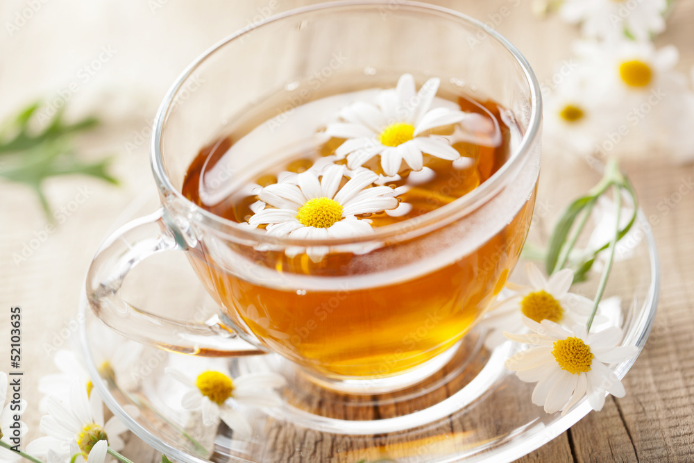 cup of herbal tea with chamomile flowers cup of herbal tea with chamomile flowers