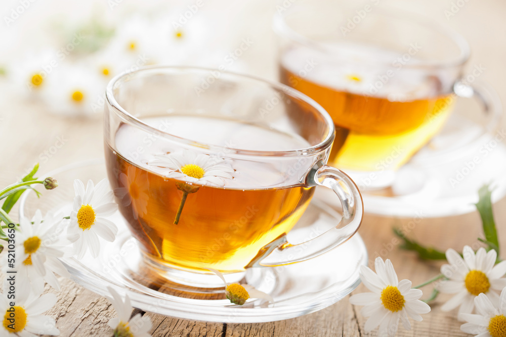 cup of herbal tea with chamomile flowers cup of herbal tea with chamomile flowers