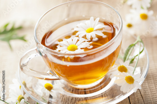 cup of herbal tea with chamomile flowers