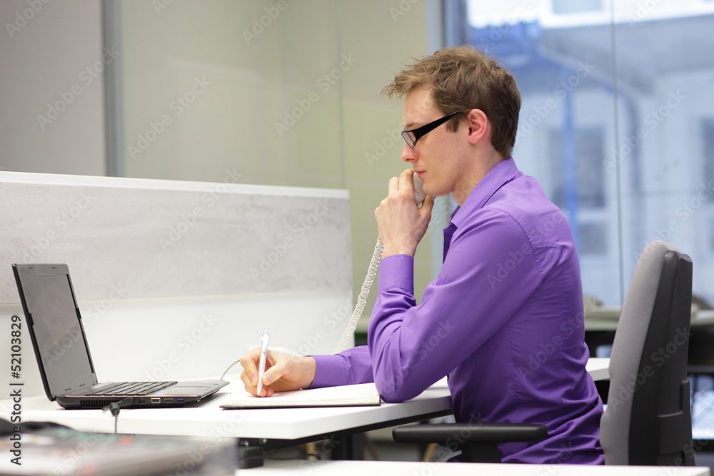 Fototapeta premium correct sitting position - man working in the office