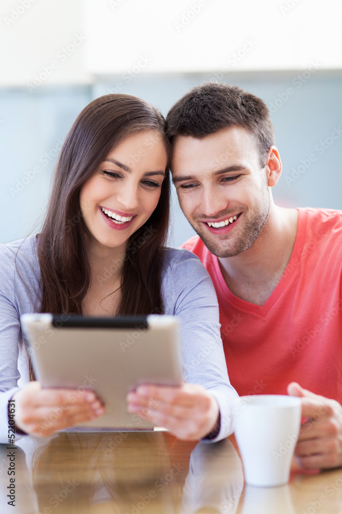 Smiling couple with digital tablet Smiling couple with digital tablet
