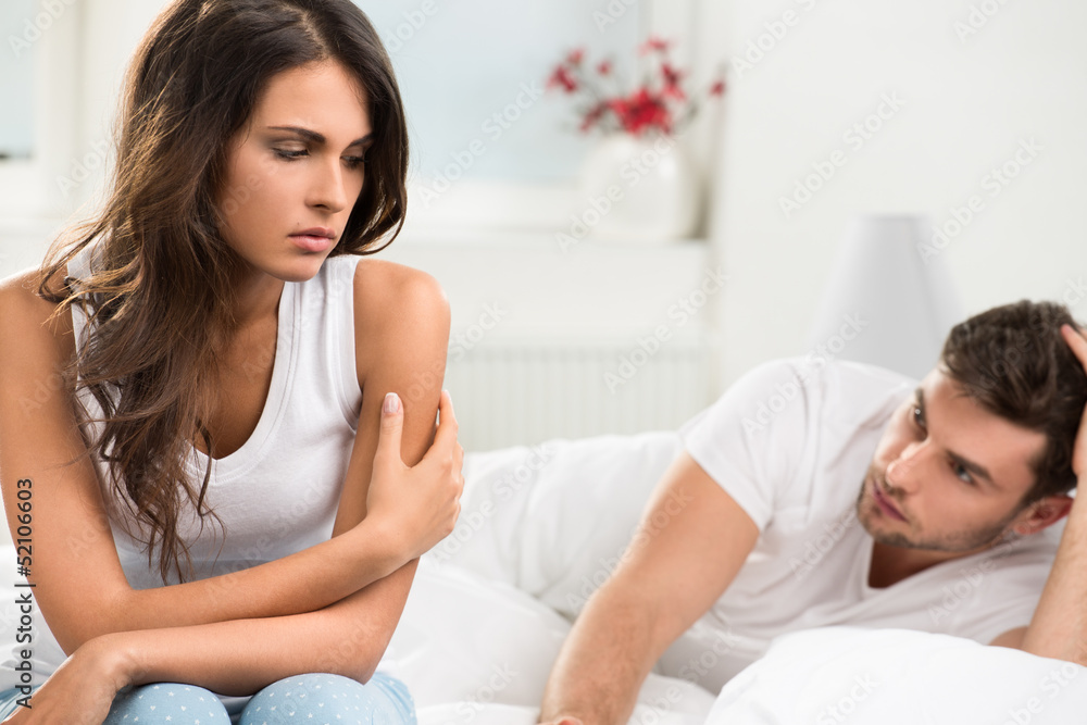 unhappy young couple in bedroom unhappy young couple in bedroom