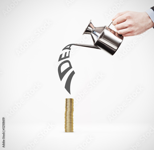 Hand watering stack of coins. The idea for the money.