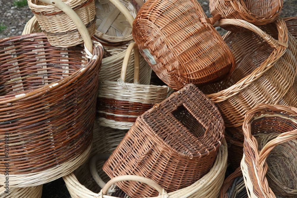 pile of Wicker baskets for sale at the local flea market pile of Wicker baskets for sale at the local flea market