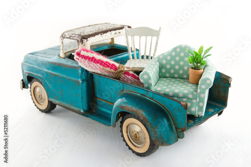 Green toy truck for moving houses