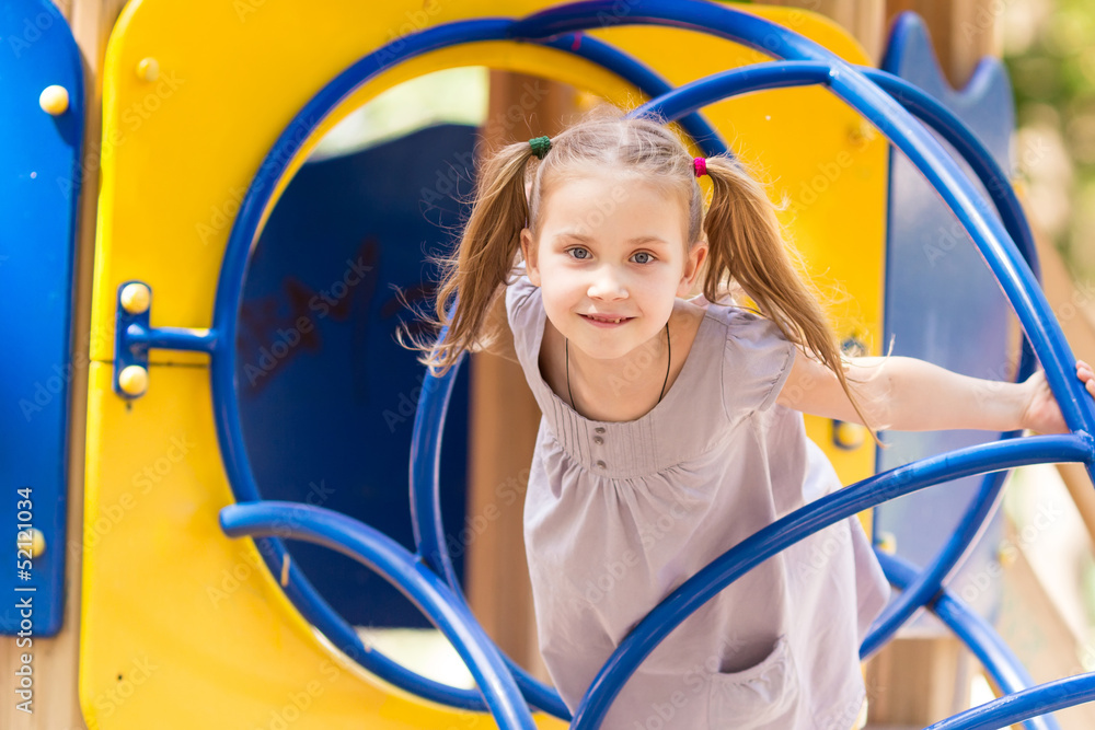 Beautiful little girl on outdoor playground Beautiful little girl on outdoor playground