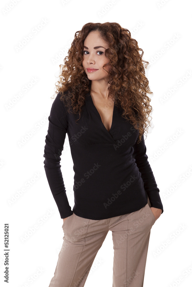 Confident woman stands with her hands in her pockets. Confident woman stands with her hands in her pockets.