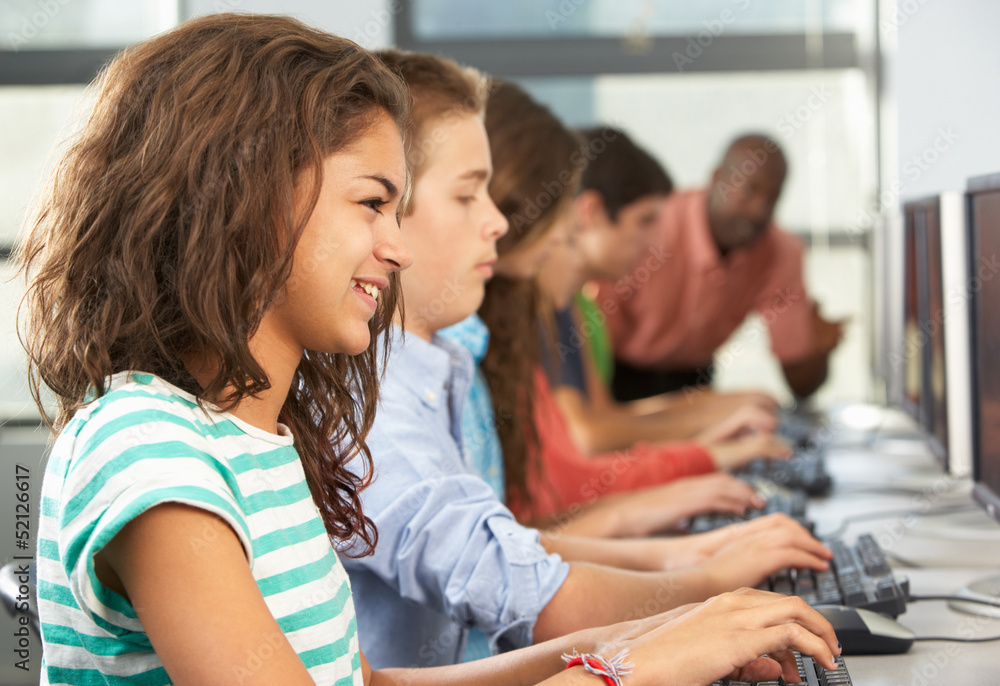 Group Of Students Working At Computers In Classroom Group Of Students Working At Computers In Classroom