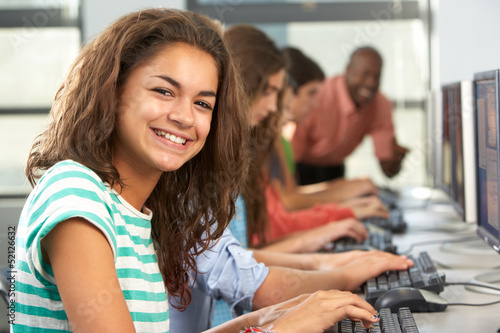 Group Of Students Working At Computers In Classroom