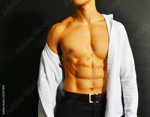 Muscular asian businessman