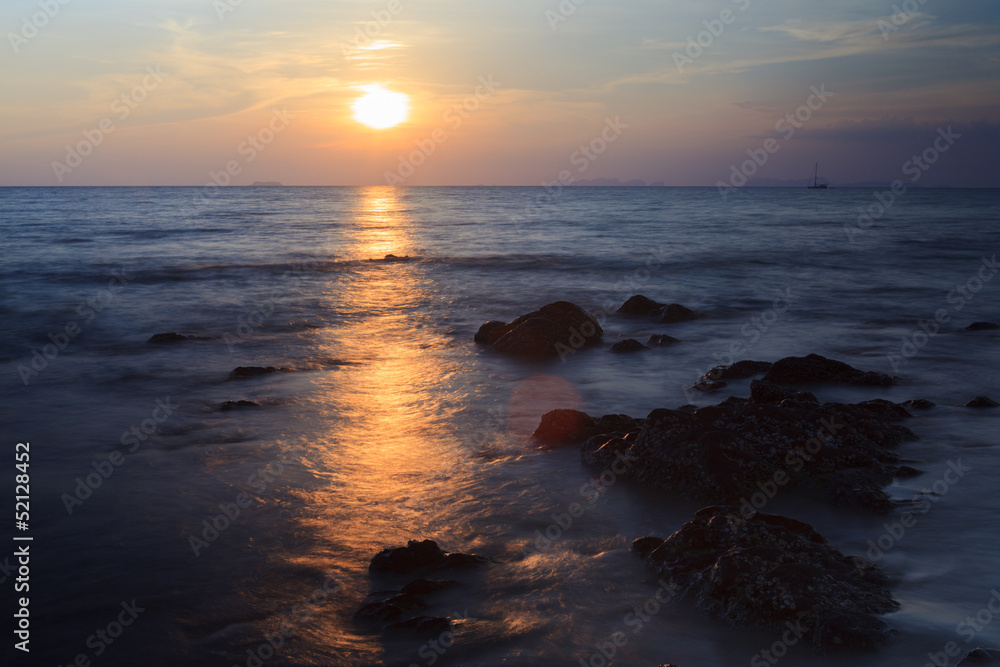 Rock on the beach with sea and blue sky Rock on the beach with sea and blue sky