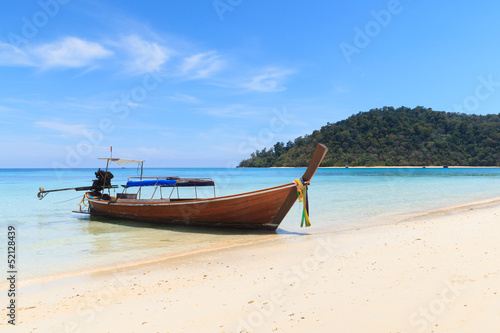 Boat on the beach with blue sky © PinkBlue