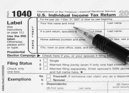 Form 1040 Tax Document with Pen