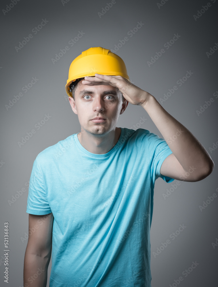 worker in helmet looks
