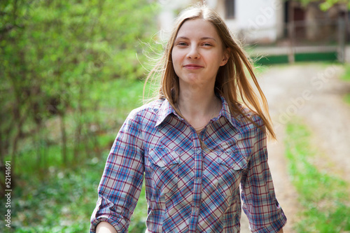 Beautiful young woman walking outdoors