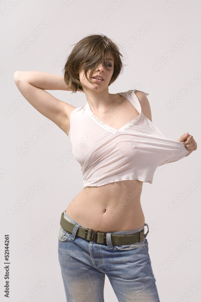 Sexy girl in blue jeans and white shirt Stock Photo | Adobe Stock