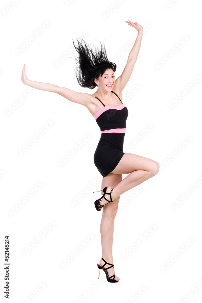 Jumping woman in little black dress on white