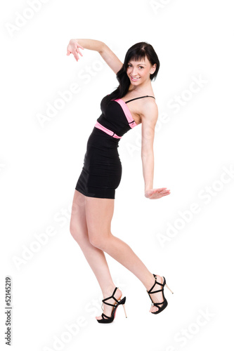 Smiling woman in little black dress on white