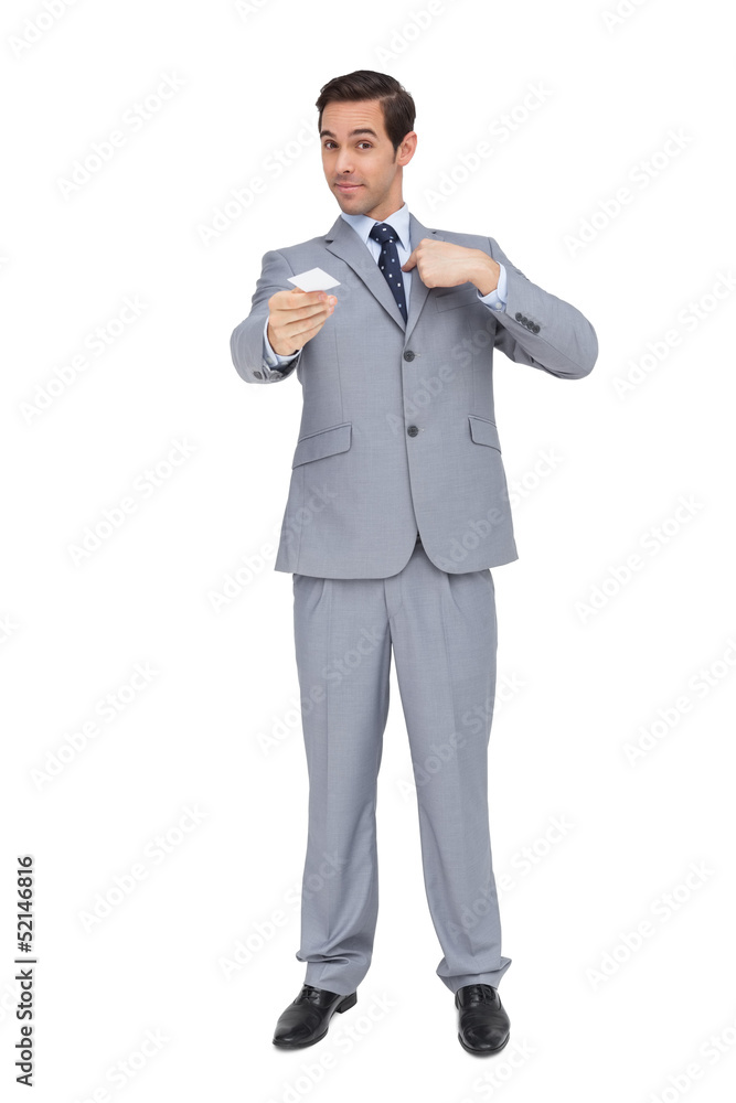 Serious businessman showing his business card