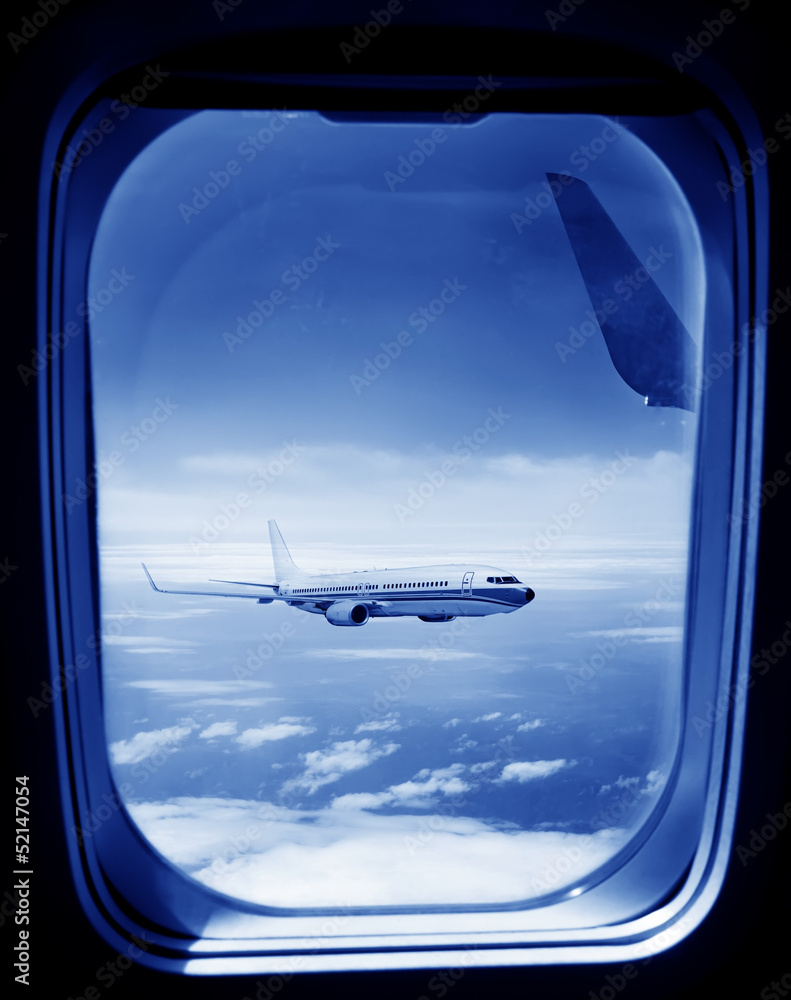 Looking out the window of a plane Looking out the window of a plane