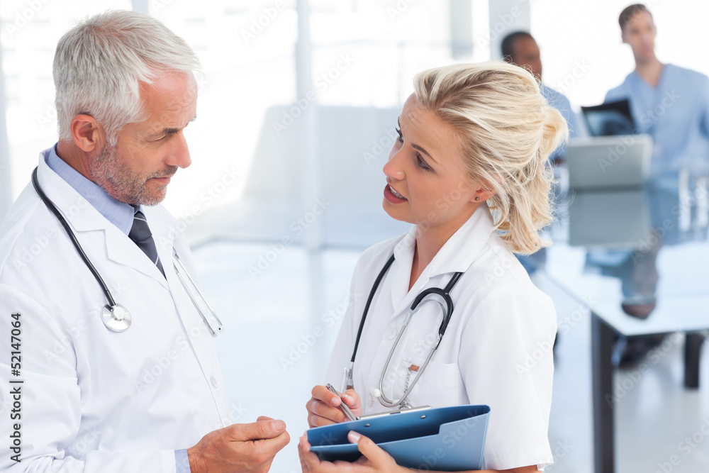 Two doctors speaking Two doctors speaking