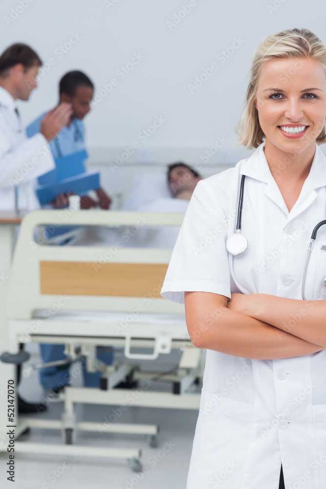 Smiling blonde nurse crossing her arms Smiling blonde nurse crossing her arms