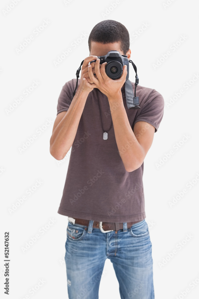 Hip young man pointing his camera at the camera Hip young man pointing his camera at the camera