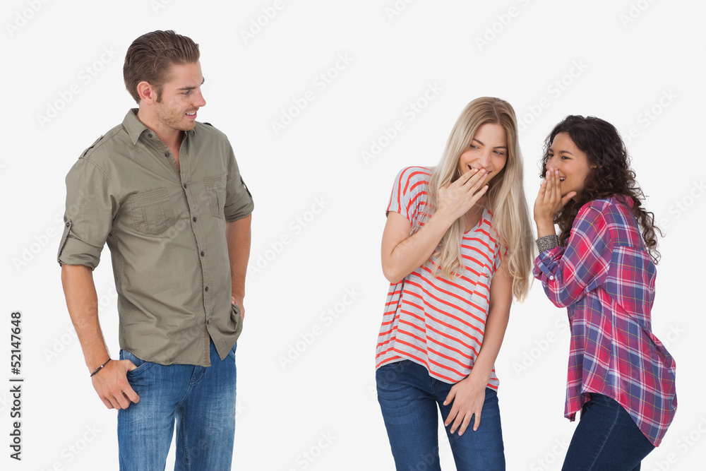 Fototapeta premium Girls laughing about secrets and leaving man out