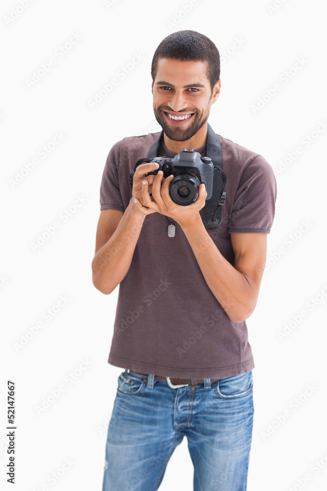 Cheerful man with camera around his neck Cheerful man with camera around his neck