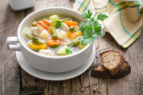 Chicken soup with vegetables photo