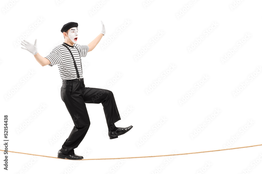 Full length portrait of an excited male mime artist walking on a Full length portrait of an excited male mime artist walking on a