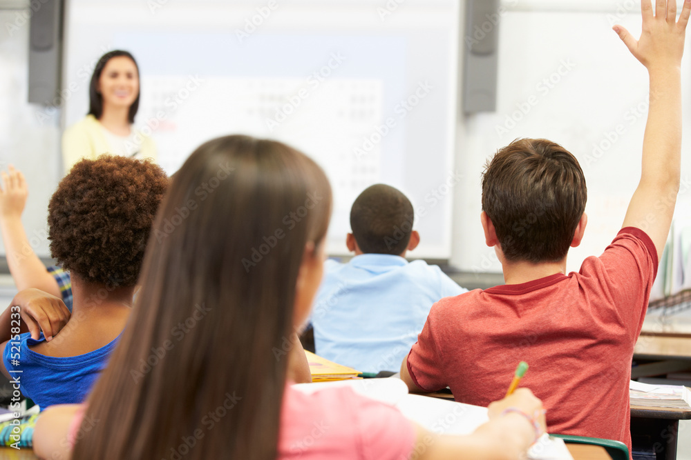 Teacher Standing In Front Of Class Asking Question Teacher Standing In Front Of Class Asking Question