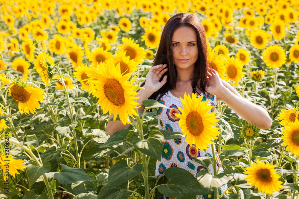 Beautiful young woman on the sunflowers field Beautiful young woman on the sunflowers field