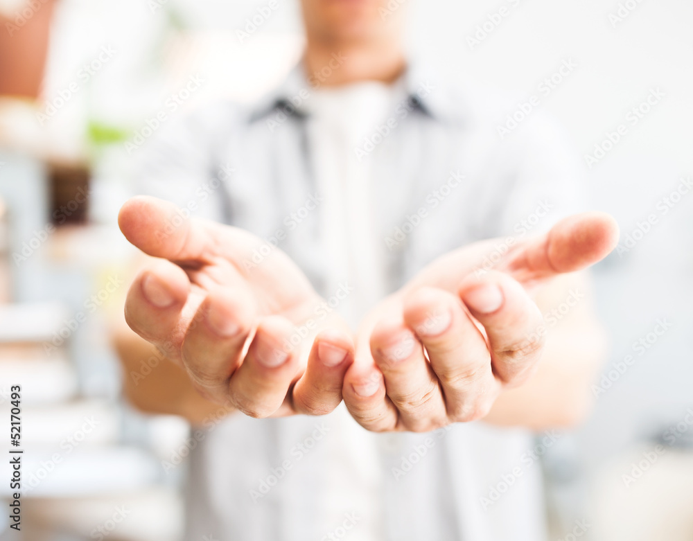 Man holding something in his hands Man holding something in his hands