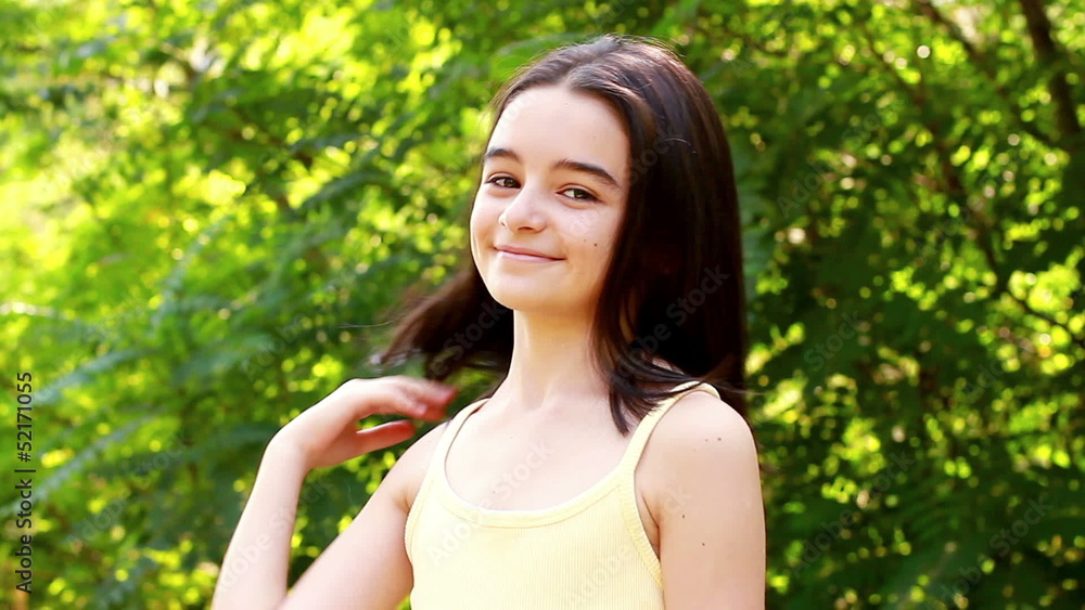 Beautiful girl looking at the camera in park Beautiful girl looking at the camera in park