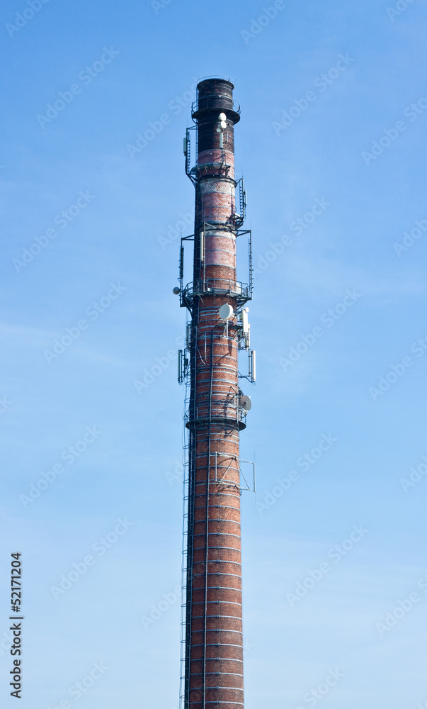Vintage industrial chimney built of red brick