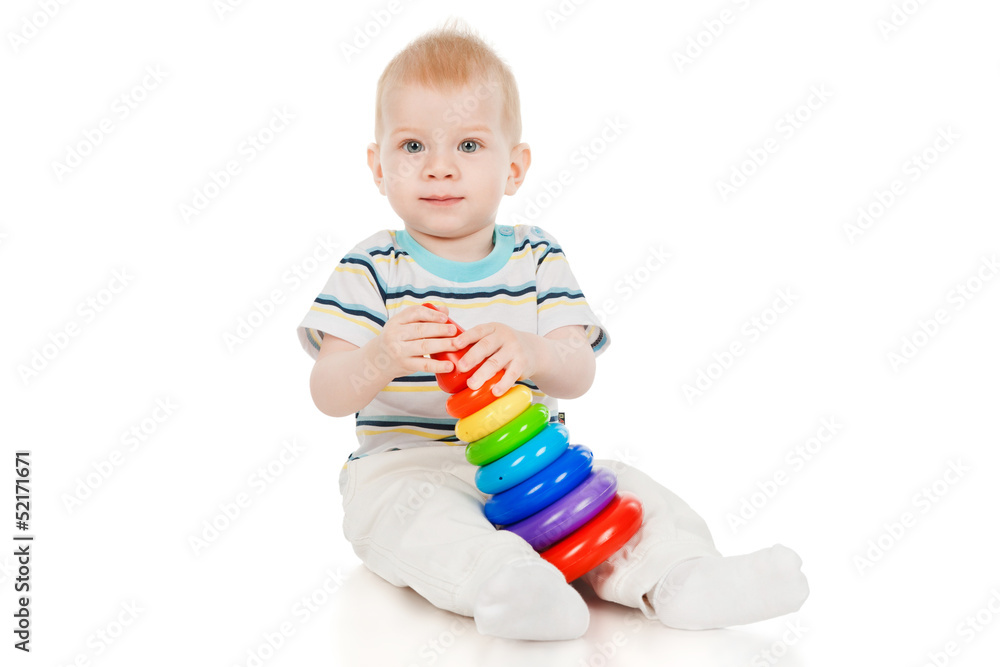 The little boy with a toy pyramid The little boy with a toy pyramid