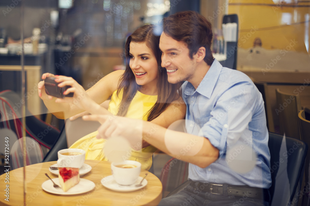 Happy couple taking photo in cafe Happy couple taking photo in cafe
