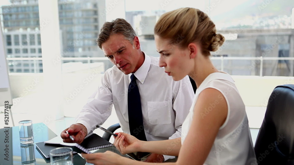 Colleagues discussing their work
