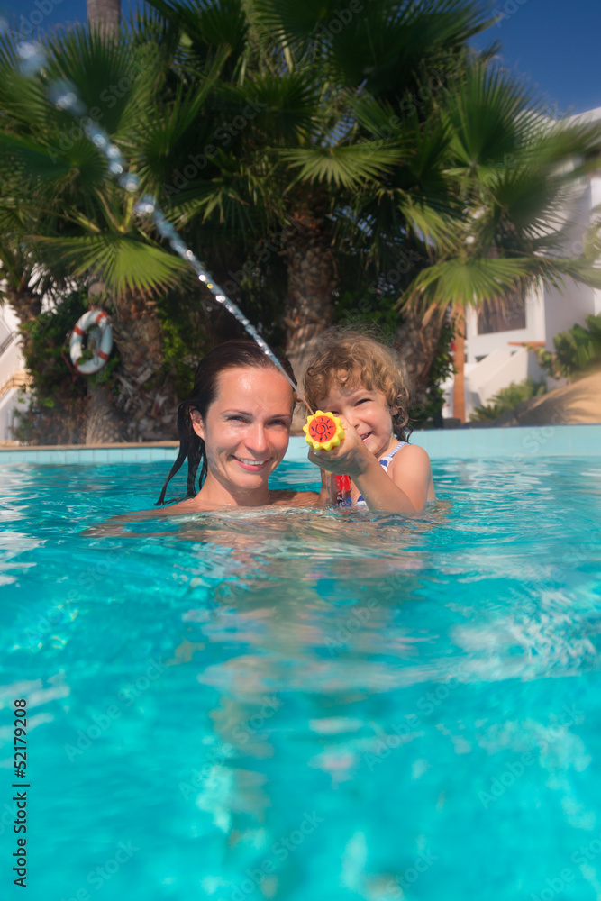 Family in swimming pool