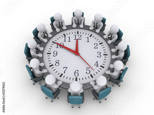 Meeting of businessmen around a clock-table